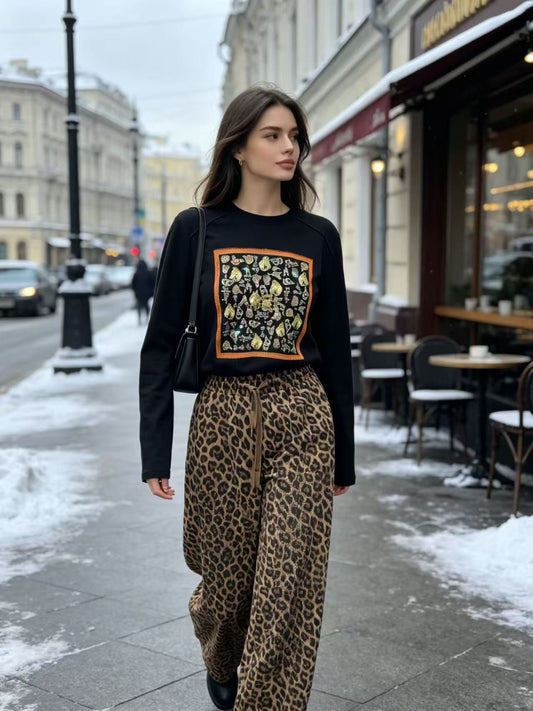 Editorial Street Shot of Equestrian Scarf Top & Leopard Wide Leg Pants
